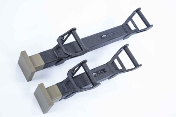A pair of black TR-1 BREACHING RAM holders on a white background.