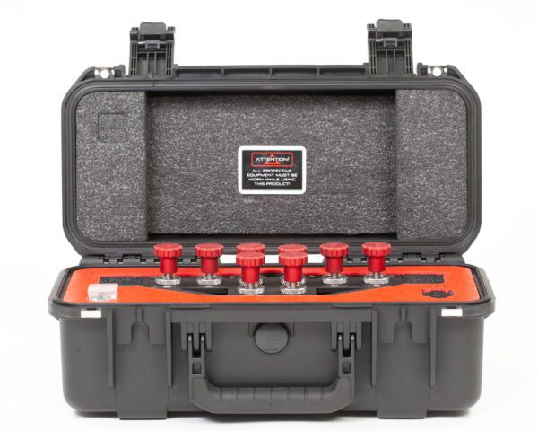 A black DRACO GAS DELIVERY SYSTEM case with four red tools in it.