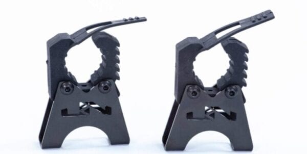 A pair of black metal clamps on a white background.