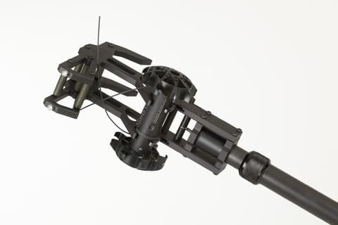 A black RDT - RECON SCOUT ROBOT DELIVERY TOOL attached to a white background.