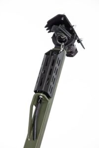 Here's an alt tag for the image: Green military-grade breaching tool.