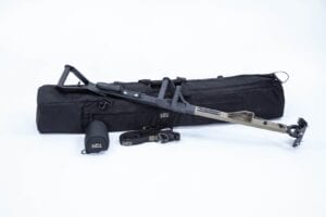 A black BP-2C Compact NFDD Delivery Pole W/Clamp Head Assembly with a gun and accessories.