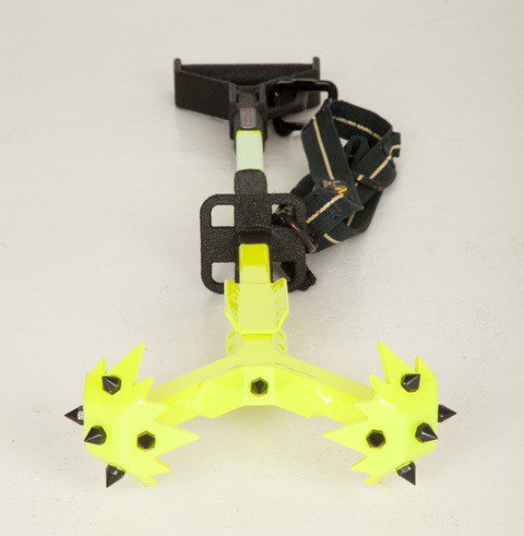 A yellow RIT-3 Tool with spikes attached to it.