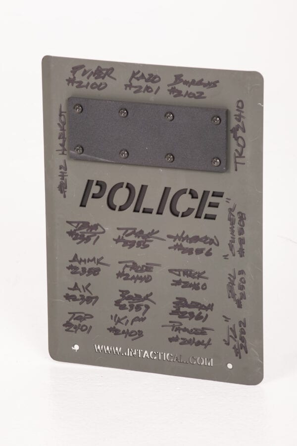 A SWAT Award - Tactical Shield plaque with writing on it.