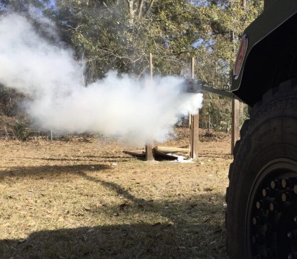 A DFS-10 - DRACO Wireless Electronic Firing System with smoke coming out of it.
